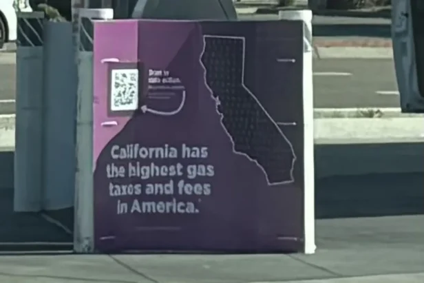 Chevron gas station sign about high gas taxes California Bay Area fuel prices