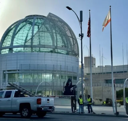 laptop screen showing article about San Jose workers demanding AI protections