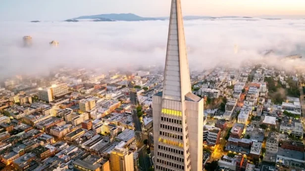 Transamerica Pyramid San Francisco aerial skyline above fog Bay Area morning view