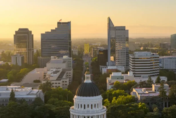 Sacramento downtown skyline with tall buildings and city lights at dusk