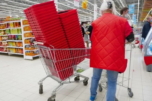 A Santa Clara city council member votes during a meeting to approve the new sales tax measure.