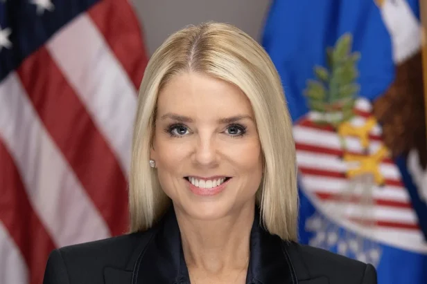 Former Florida Attorney General Pam Bondi speaks at a podium during a press conference or public event.