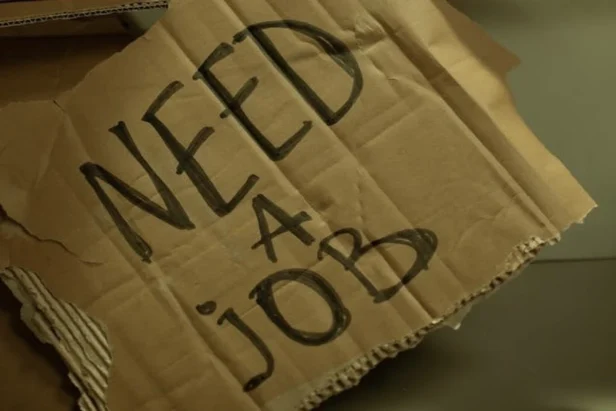Bay Area office workers pack belongings at their desks during recent corporate layoffs affecting the tech industry.