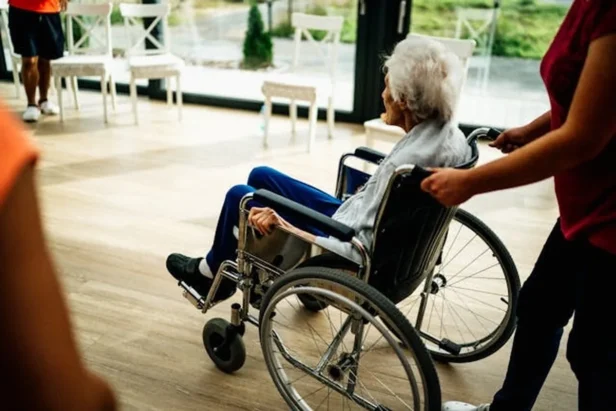 Elderly adults participate in activities at an adult day health care center in California, receiving community-based services