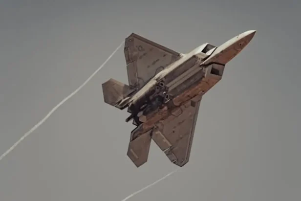 U.S. Air Force F-15E Strike Eagle fighter jet flies over mountainous terrain during a military operation.
