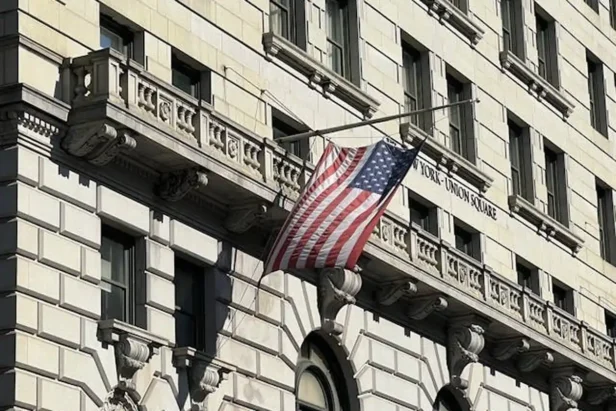 U.S. Customs and Border Protection officer processes migrants at a border crossing using the CBP One mobile application syste