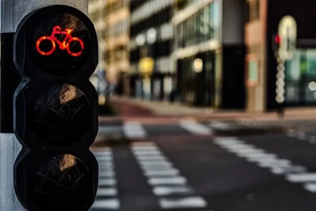 Police officer writes a citation ticket for a cyclist on a San Francisco street.