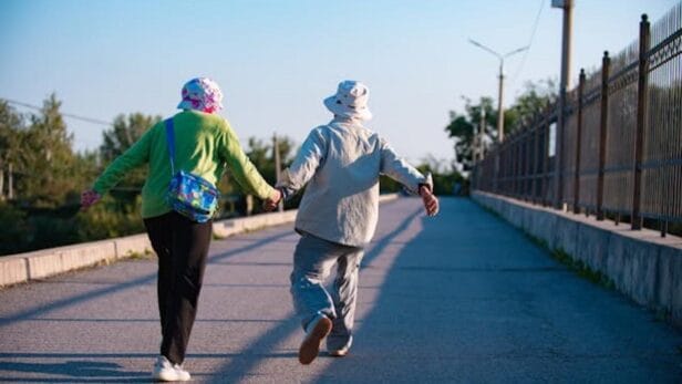 California state employee reviews paperwork at desk amid investigation into understaffed agency responsible for elderly care